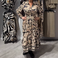 Vestido elegante de manga larga con estampado floral
